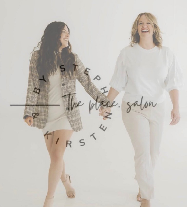 Steph and Kirsten smiling together, with the place.salon logo.